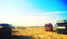 The trucks of ACRIS AGRO company are on the field